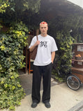 DAXUEN Ornate script graphic short-sleeved T-shirt — model photo