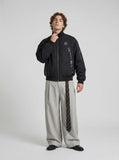 DAXUEN Oversized bomber jacket in black and navy — model photo