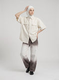 DAXUEN Oversized short-sleeve button-up shirt in cream and brown — model photo