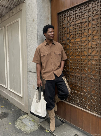 DAXUEN Oversized short-sleeve button-up shirt in cream and brown — model photo