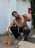 DAXUEN Oversized short-sleeve button-up shirt in cream and brown — model photo