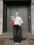 DAXUEN Oversized short-sleeve button-up shirt in cream and brown — model photo