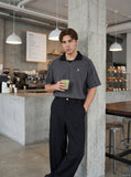 DAXUEN Men's oversized short-sleeved polo shirt — model photo