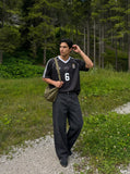 DAXUEN dark charcoal oversized wide-leg denim trousers — model photo