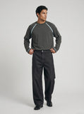 DAXUEN dark charcoal oversized wide-leg denim trousers — model photo