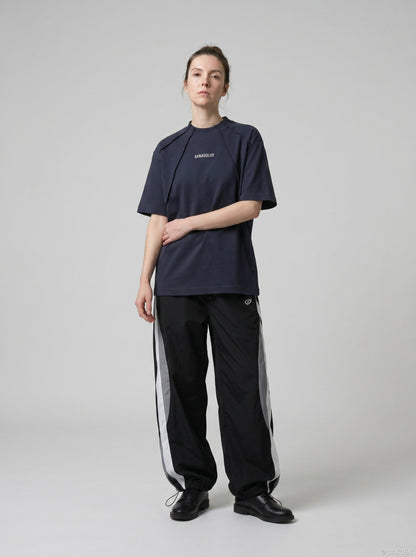 DAXUEN Oversized deconstructed t-shirt in olive green and navy — model photo