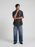 DAXUEN Oversized denim button-up shirt with reflective designs — model photo