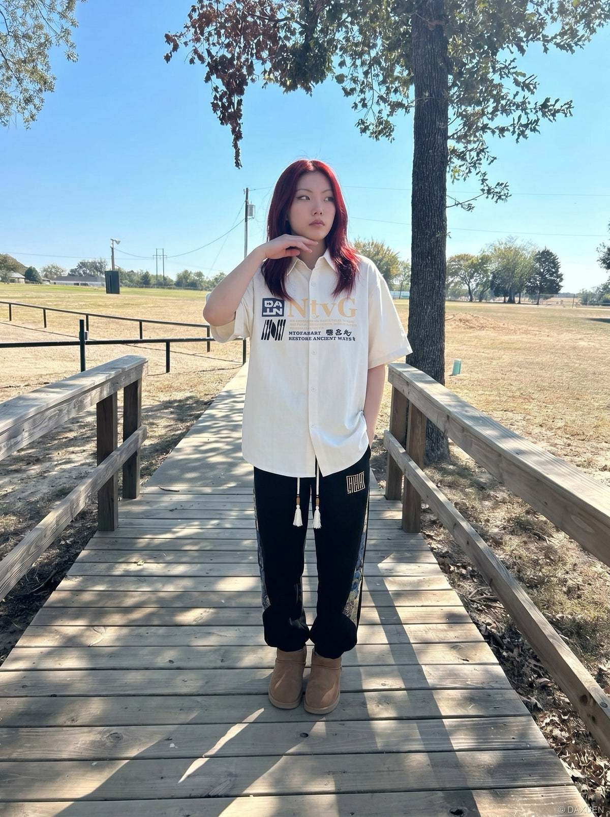 DAXUEN Oversized short-sleeve button-up shirt with graphic print — model photo