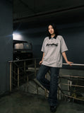 DAXUEN Oversized polo shirt with graphic and embroidery — model photo
