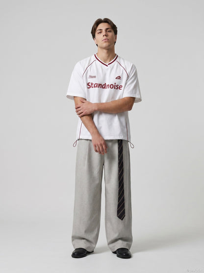 DAXUEN Oversized V-neck graphic t-shirt with drawstring hem — model photo