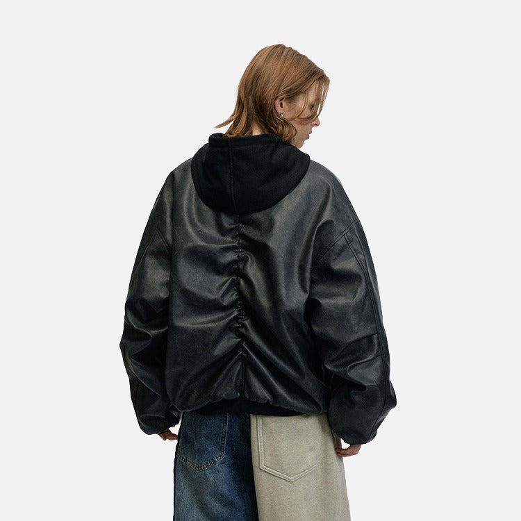 DAXUEN Oversized hooded bomber jacket in black faux leather — model photo