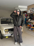 DAXUEN Oversized hooded bomber jacket in black faux leather — model photo