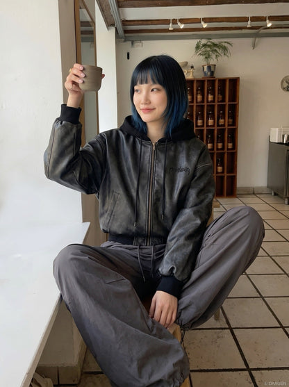 DAXUEN Oversized hooded bomber jacket in black faux leather — model photo