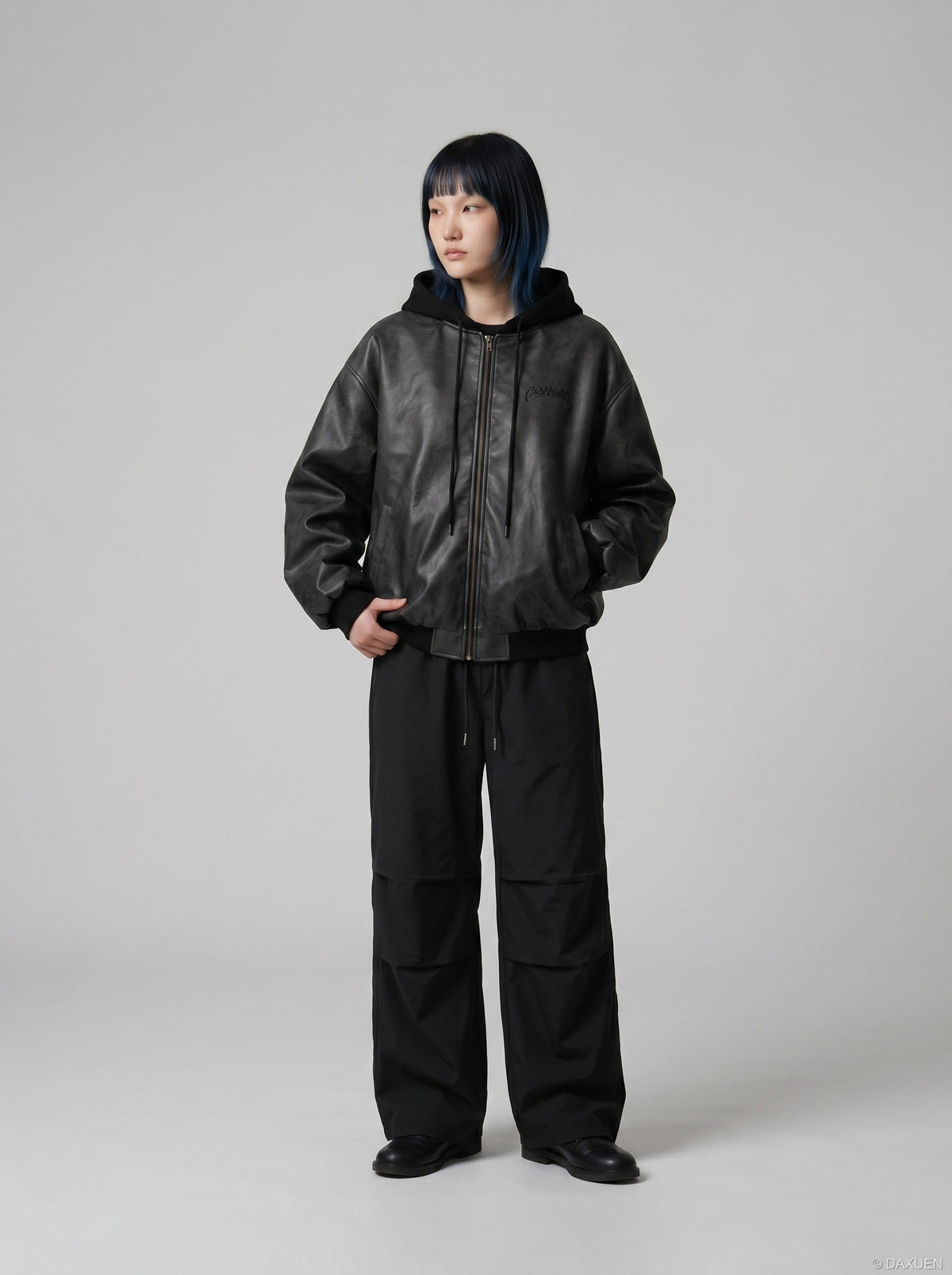 DAXUEN Oversized hooded bomber jacket in black faux leather — model photo