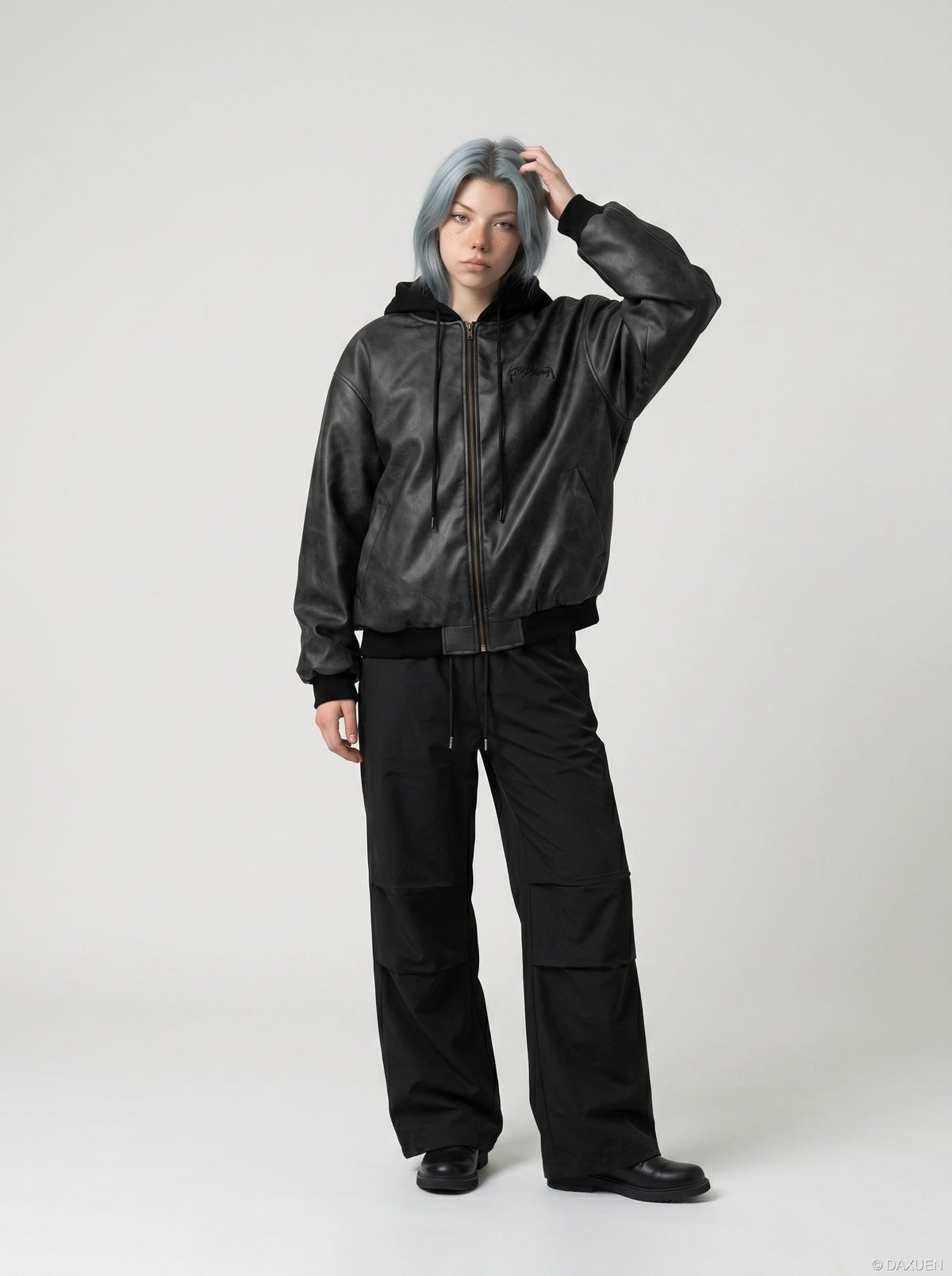 DAXUEN Oversized hooded bomber jacket in black faux leather — model photo