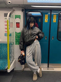 DAXUEN Oversized hooded bomber jacket in black faux leather — model photo