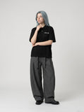 DAXUEN Short-sleeved oversized polo shirt with script embroidery — model photo
