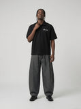 DAXUEN Short-sleeved oversized polo shirt with script embroidery — model photo