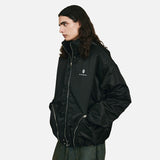 DAXUEN Padded bomber jacket in black and sage green colors — model photo
