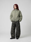 DAXUEN Padded bomber jacket in black and sage green colors — model photo