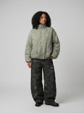 DAXUEN Padded bomber jacket in black and sage green colors — model photo
