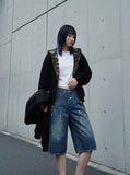 DAXUEN blue distressed paint-splatter denim shorts — model photo