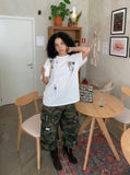 DAXUEN Oversized crew neck t-shirt with palm tree graphics — model photo