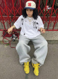 DAXUEN Oversized crew neck t-shirt with palm tree graphics — model photo