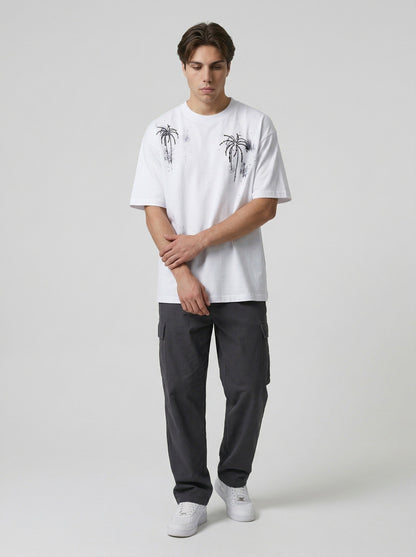 DAXUEN Oversized crew neck t-shirt with palm tree graphics — model photo