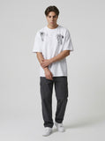 DAXUEN Oversized crew neck t-shirt with palm tree graphics — model photo