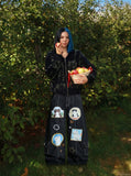 DAXUEN Black wide leg cargo pants with colorful cat patches — model photo
