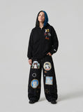 DAXUEN Black wide leg cargo pants with colorful cat patches — model photo