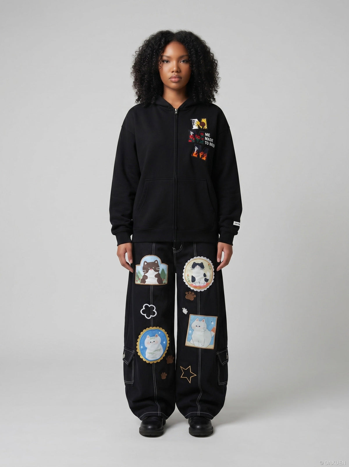 DAXUEN Black wide leg cargo pants with colorful cat patches — model photo