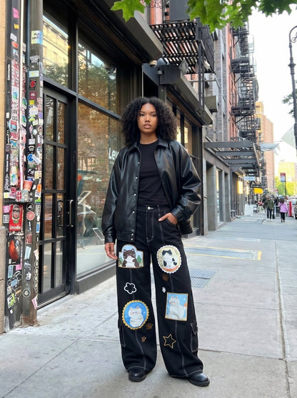 DAXUEN Black wide leg cargo pants with colorful cat patches — model photo