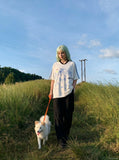 DAXUEN white oversized pixelated anime character tee — model photo