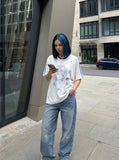 DAXUEN white oversized pixelated anime character tee — model photo