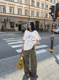 DAXUEN white oversized pixelated anime character tee — model photo