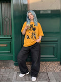 DAXUEN Oversized short-sleeved T-shirt with pixelated graphic — model photo