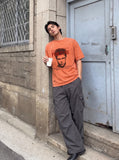 DAXUEN washed blue oversized pixelated face graphic t-shirt — model photo