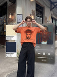DAXUEN washed blue oversized pixelated face graphic t-shirt — model photo