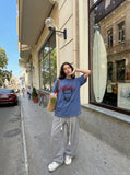 DAXUEN washed blue oversized pixelated face graphic t-shirt — model photo