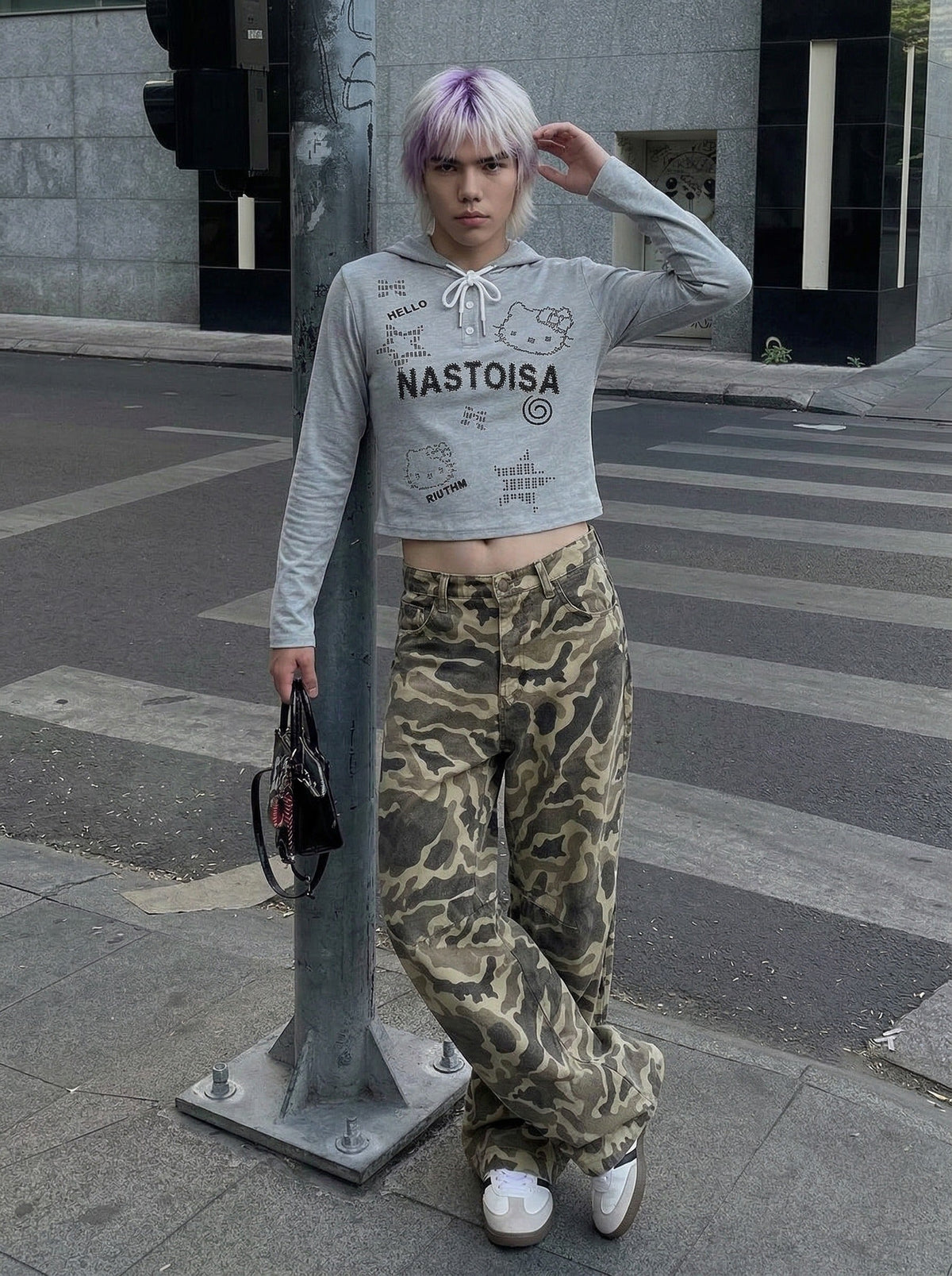DAXUEN Cropped hooded long-sleeve top with pixelated graphics — model photo