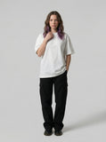 DAXUEN Oversized short-sleeved t-shirt with plaid script print — model photo
