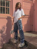 DAXUEN Oversized short-sleeved t-shirt with plaid script print — model photo