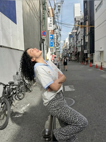 DAXUEN Playful hooded top with cartoon embroidery and striped details — model photo