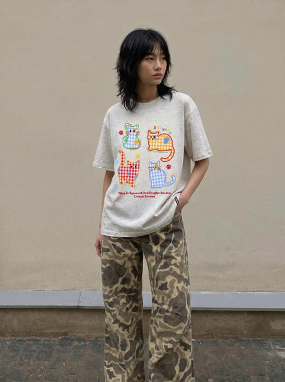 DAXUEN Playful cat graphic t-shirt — model photo