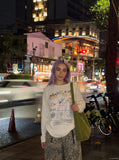 DAXUEN Long-sleeve t-shirt with crayon graphic — model photo