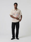 DAXUEN Beige short-sleeved button-up shirt with polka dots — model photo