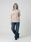 DAXUEN Beige short-sleeved button-up shirt with polka dots — model photo