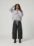 DAXUEN Dark grey wide-leg cropped cargo pants with polka dots — model photo